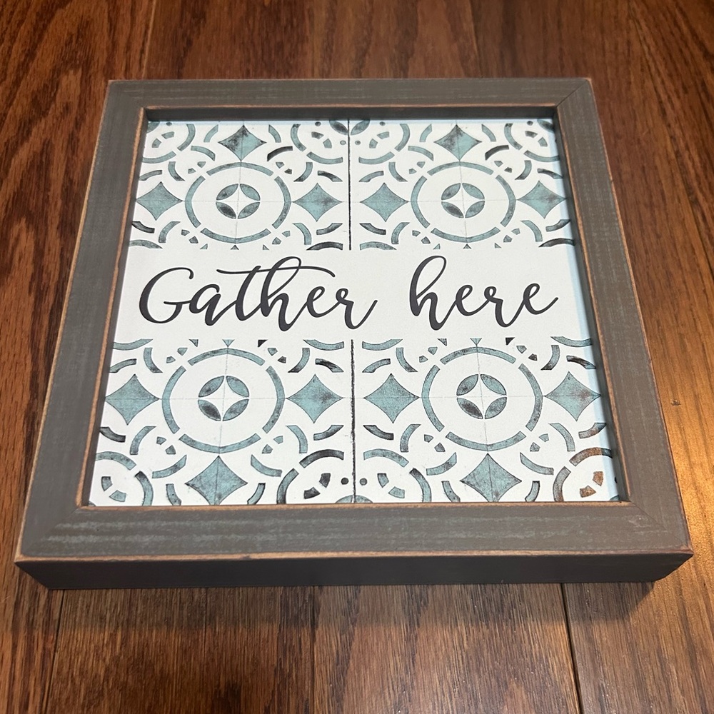 Decorative Wall Art with 'Gather Here' Text on Faux Tile Background